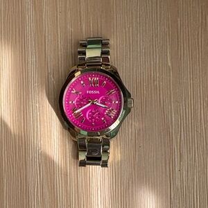 Gold and pink Fossil watch